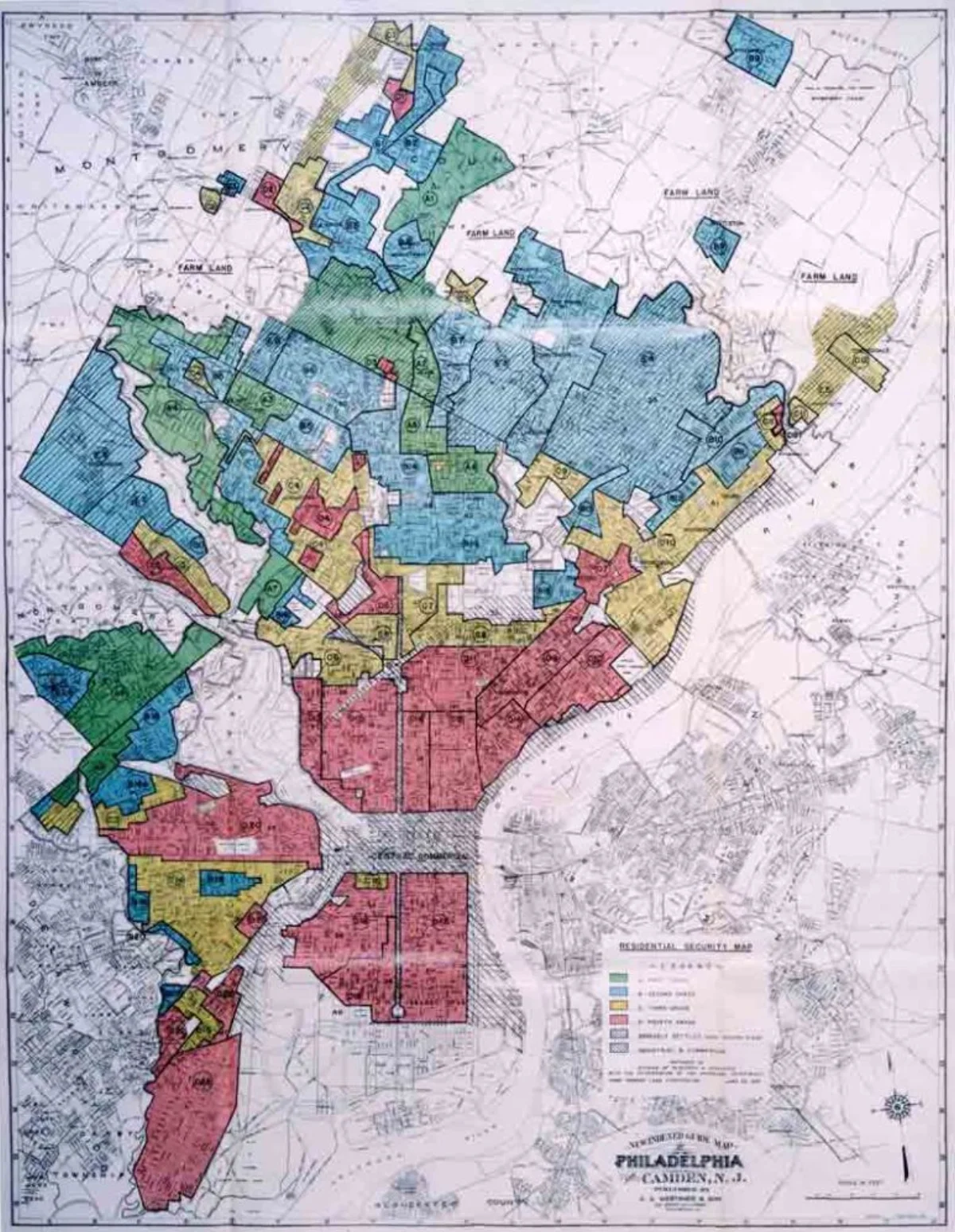 A 1937 Home Owners' Loan Corporation 'Residential Security Map' of Philadelphia, color-coded by neighborhood: green ('best'), blue ('still desirable'), yellow ('definitely declining'), and red ('hazardous'). Large swaths of the inner city near the Delaware River and West Philadelphia are colored red, while wealthier suburban neighborhoods to the northwest are predominantly green and blue