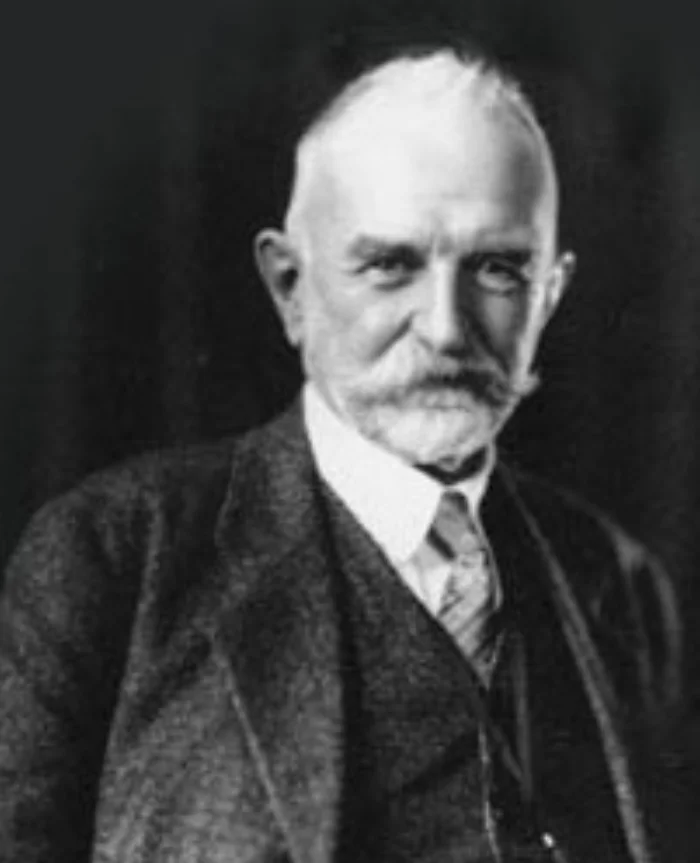 Black-and-white photograph of an elderly George Herbert Mead in a three-piece suit and tie, with a thick white moustache and a serious expression