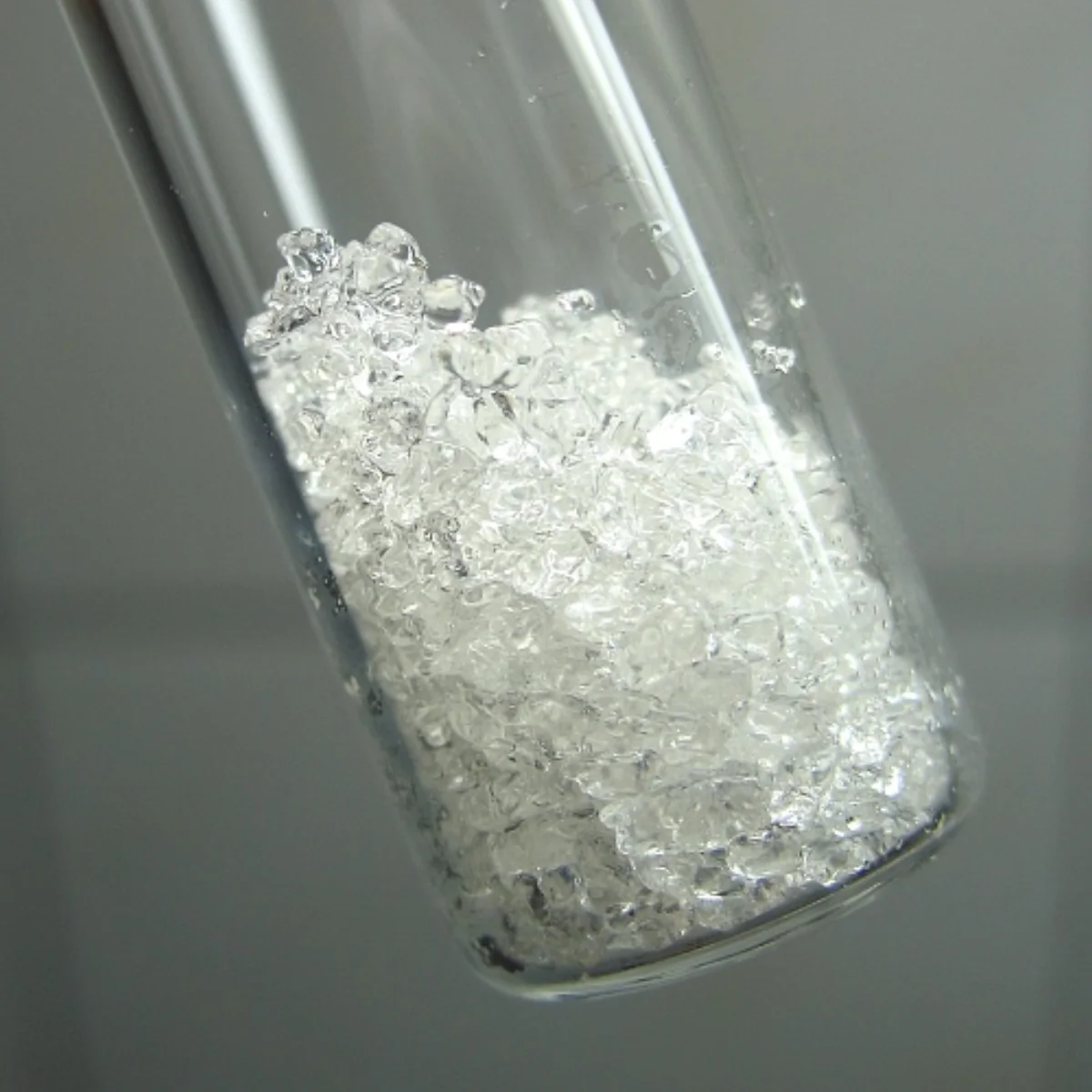 White crystalline phenol in a laboratory setting